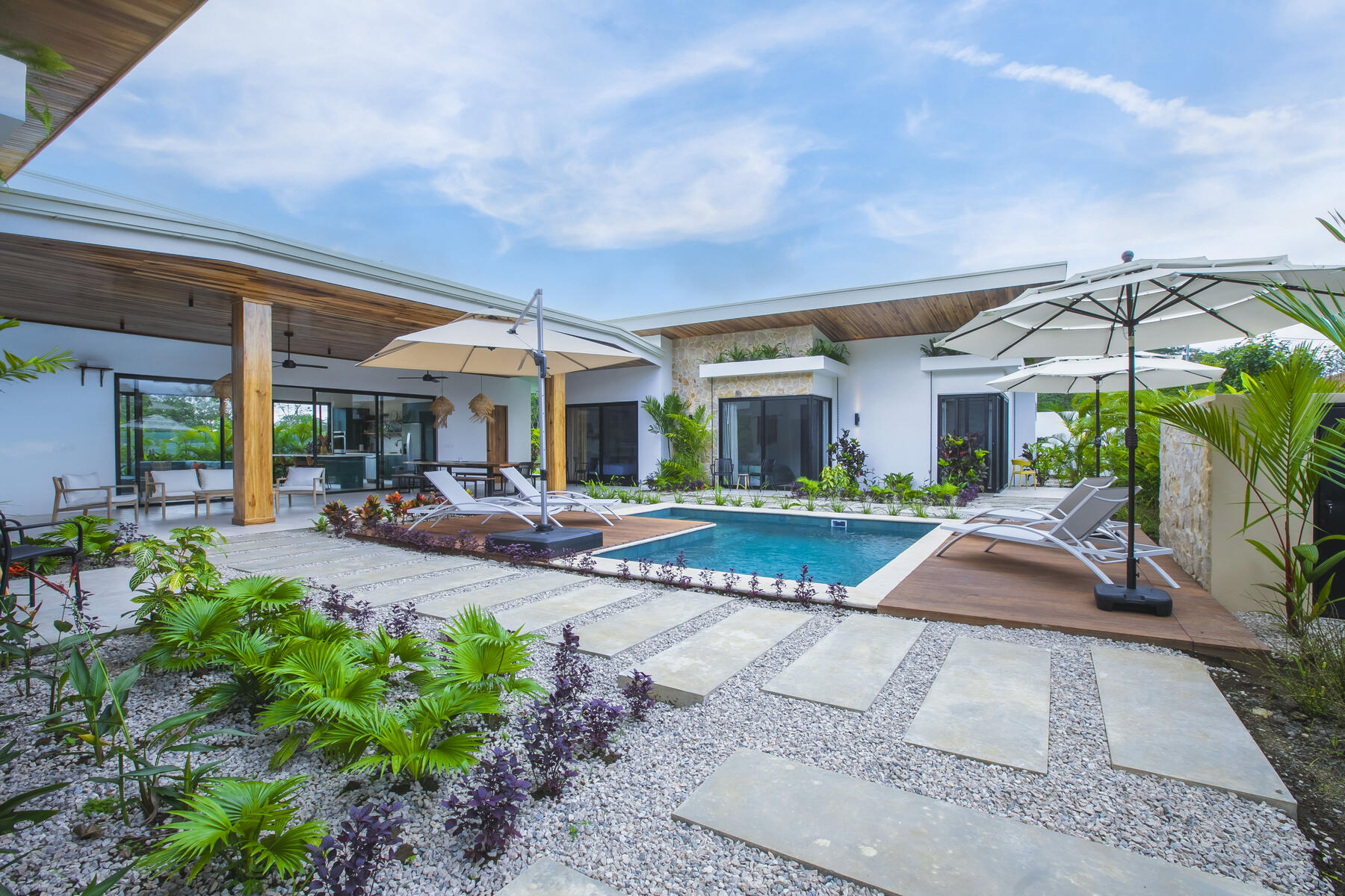 Villa and pool in lush grounds