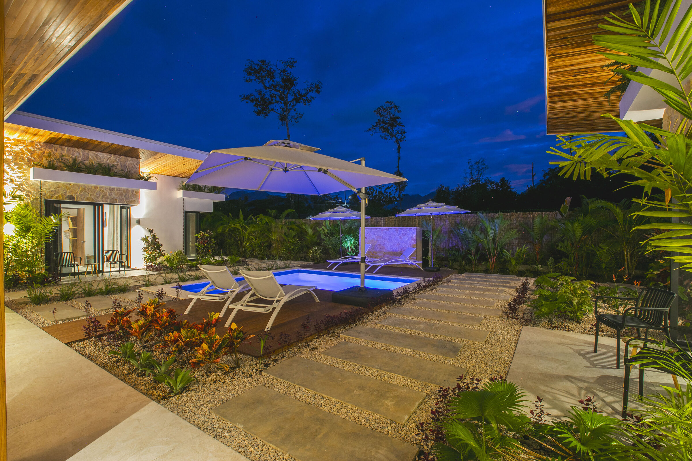 Villa Amara's private pool lit at dusk, La Fortuna, Costa Rica