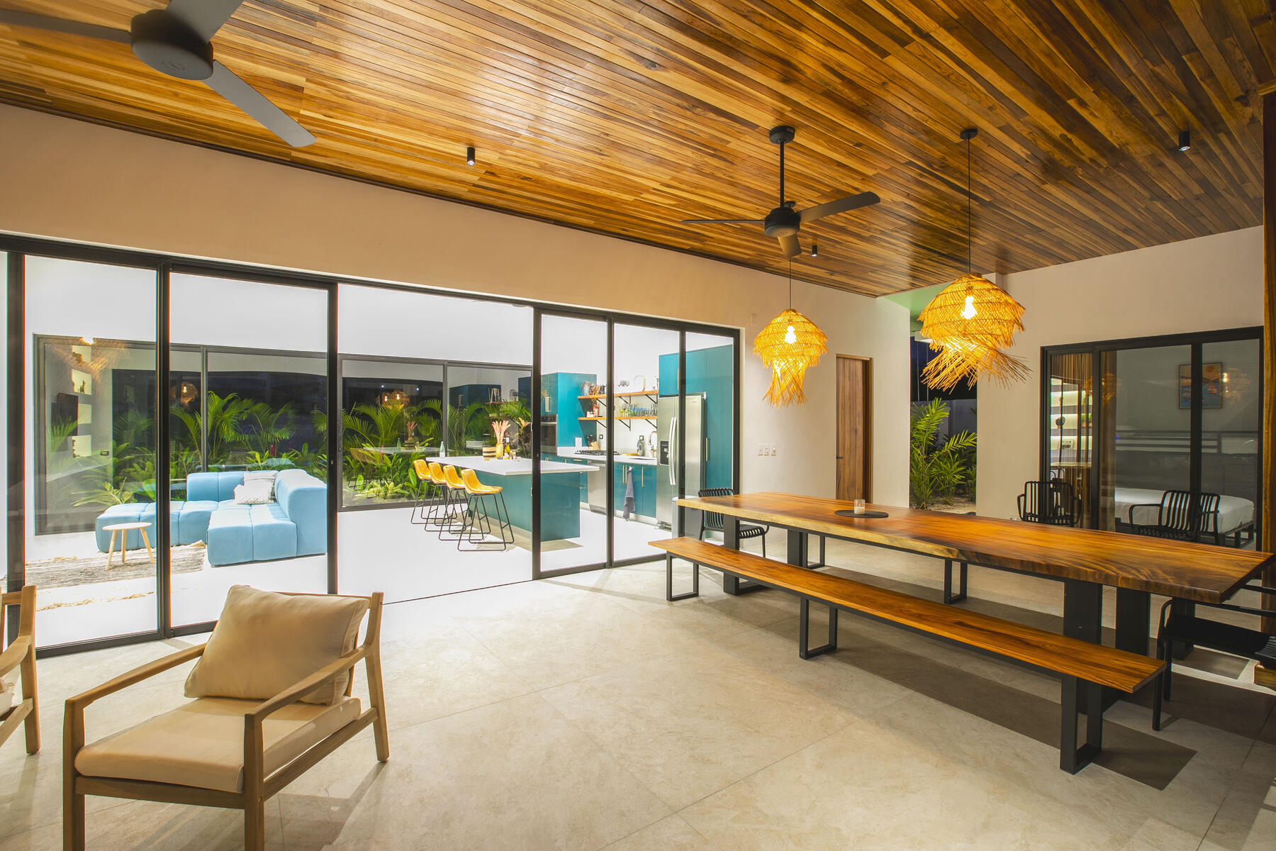 Open-plan living at Villa Amara opening onto the pool and gardens
