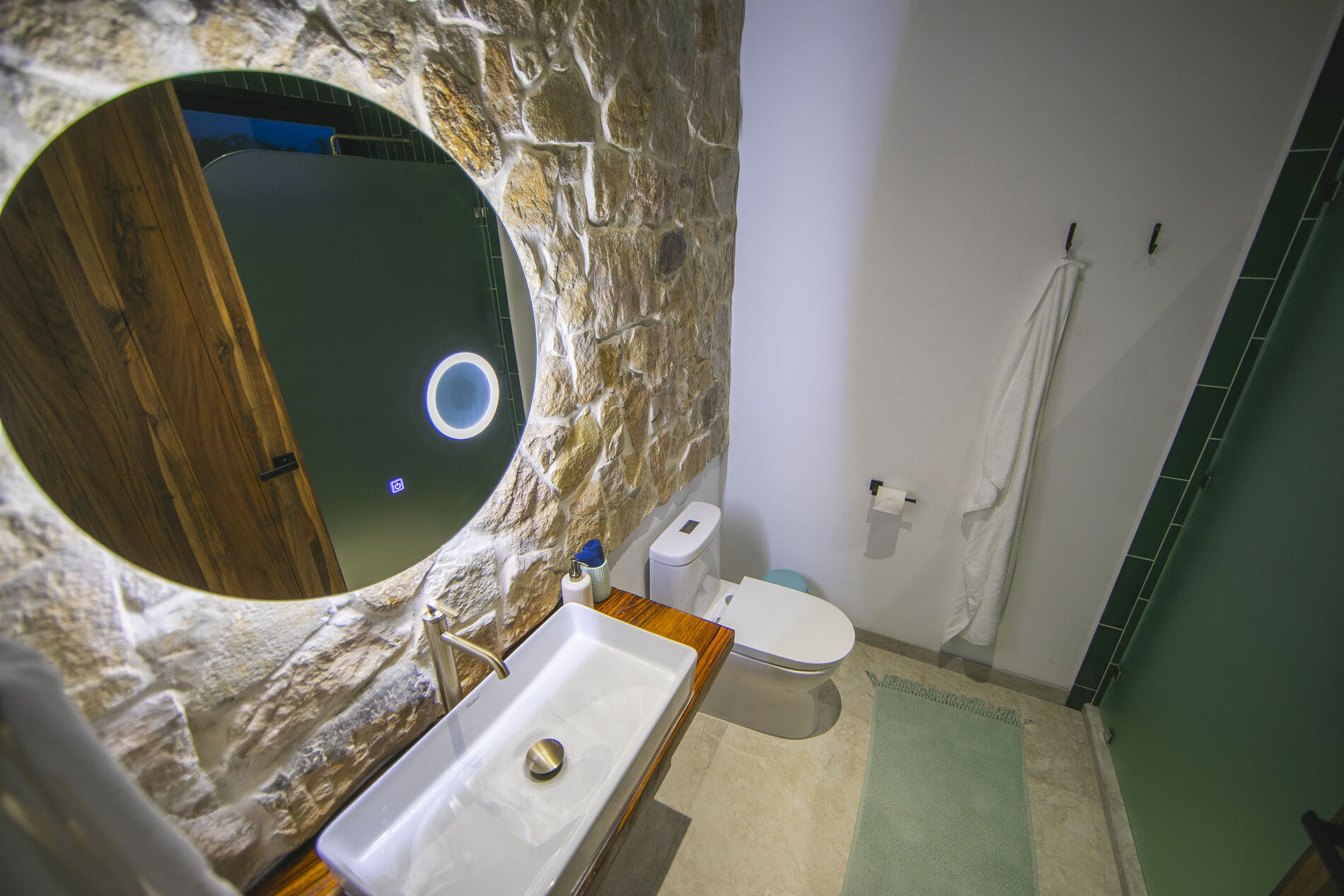 Ensuite bathroom with a round window