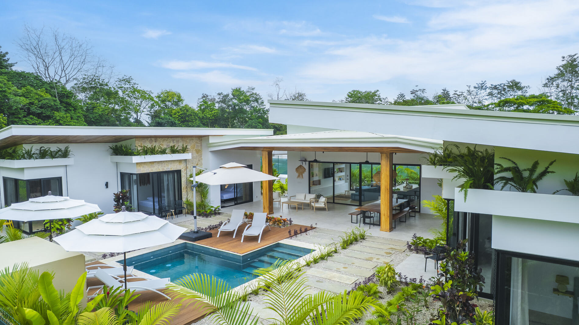 Villa and pool set in lush grounds